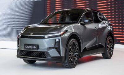 A sleek gray Toyota C-HR on display under soft lighting.