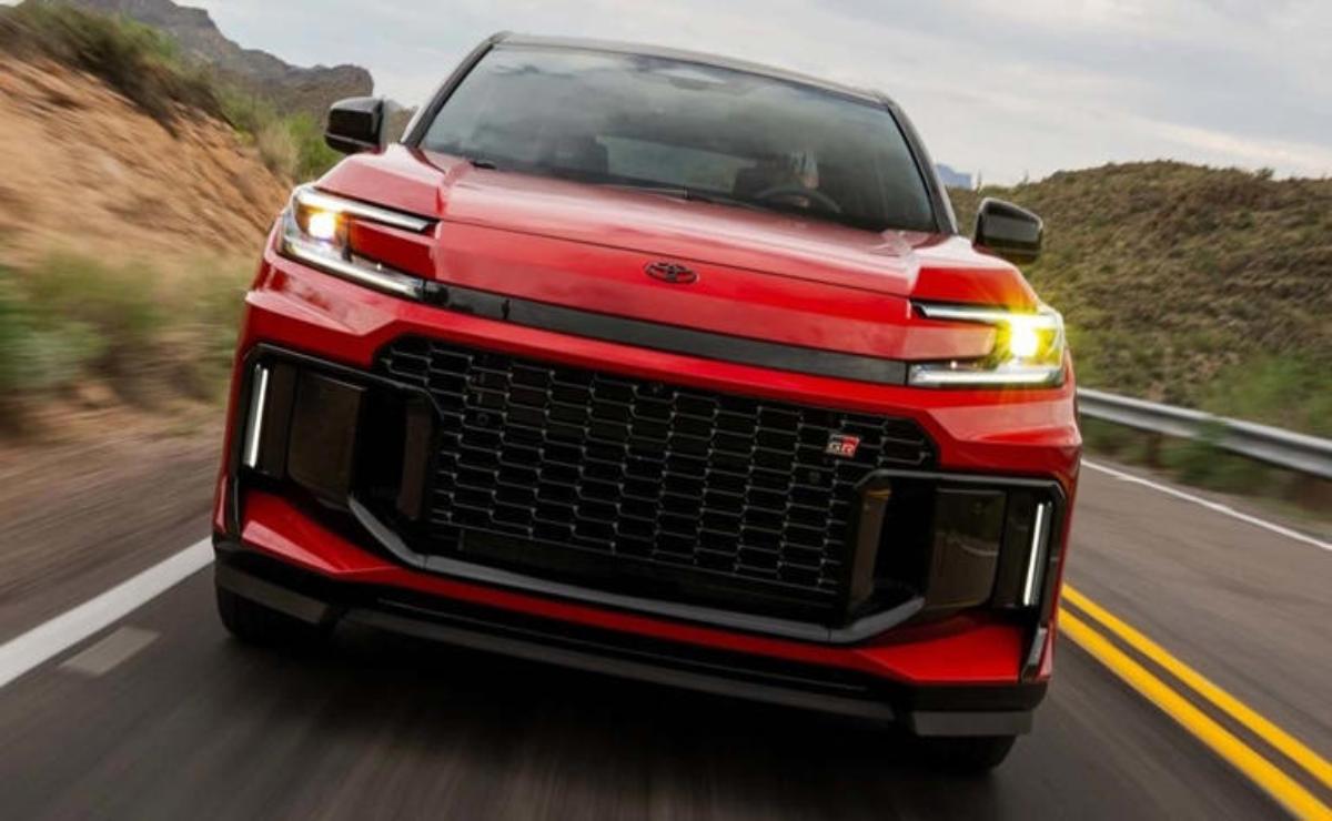 Sleek red sports car speeding on a road with modern design.