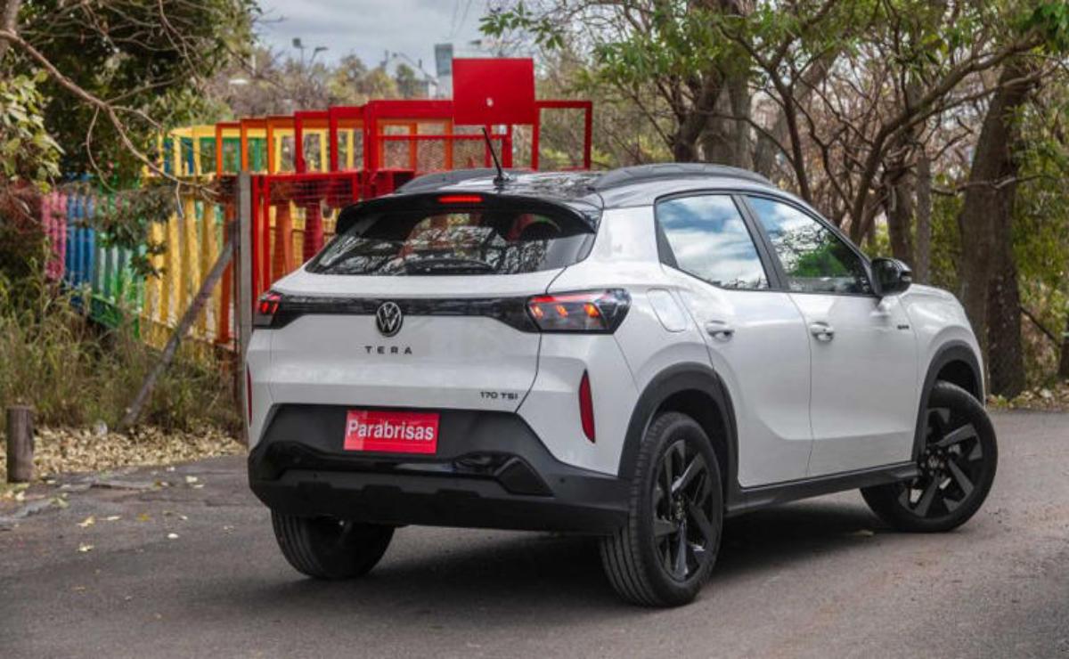 White Toyota Urban Cruiser parked near a red playground structure.