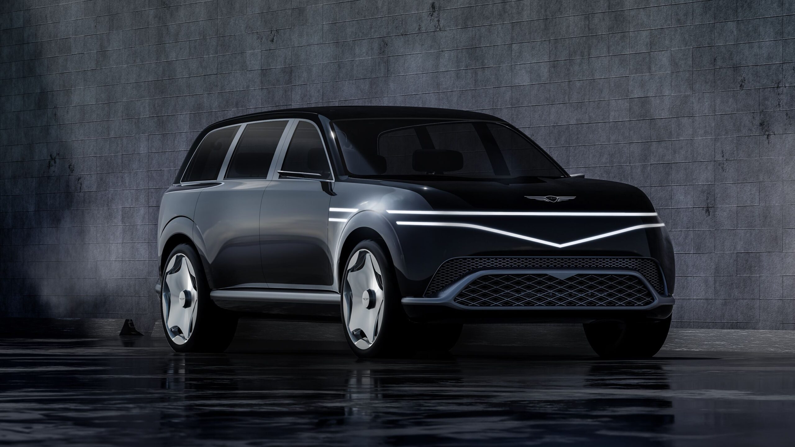Sleek black luxury electric SUV with modern design and illuminated accents.