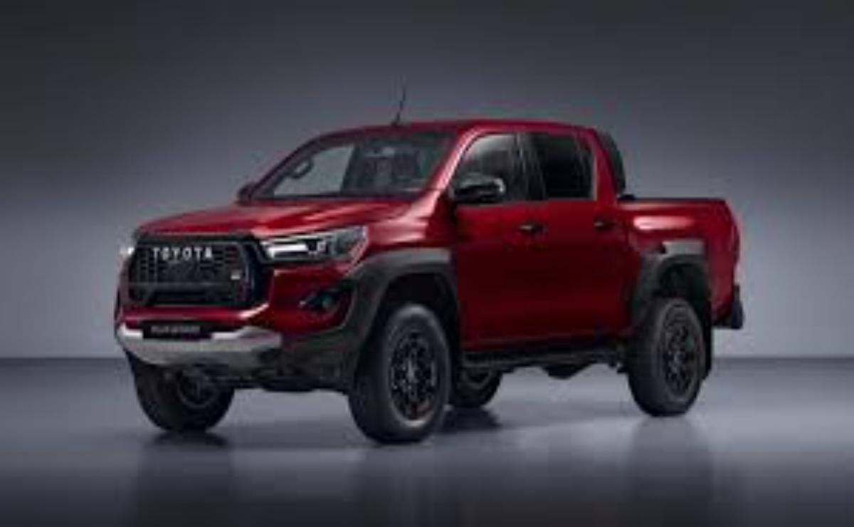A sleek red Toyota pickup truck with black accents.