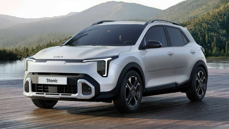 Sleek white SUV parked on a paved road with mountains in the background.