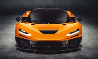 Sleek orange sports car with aggressive front design and black accents.