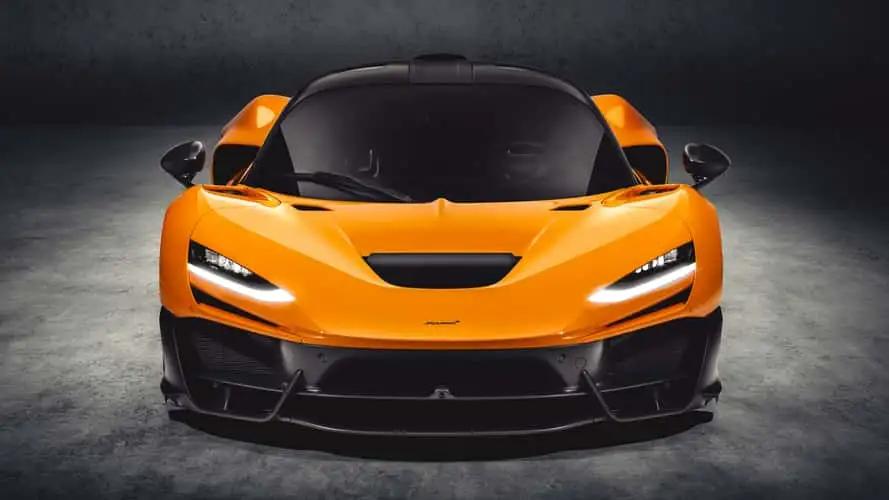 Sleek orange sports car with aggressive front design and black accents.