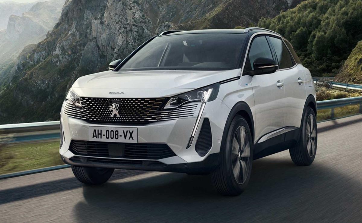 A white Peugeot SUV parked outdoors with mountains in the background.