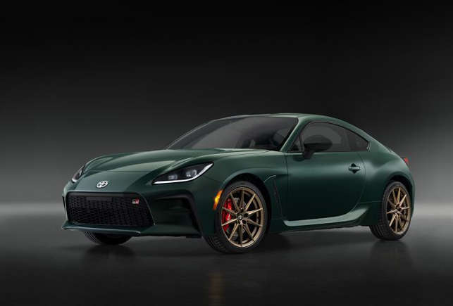 Dark green sports car with sleek design and red brake calipers.