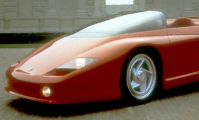 A sleek red sports car with futuristic design details.