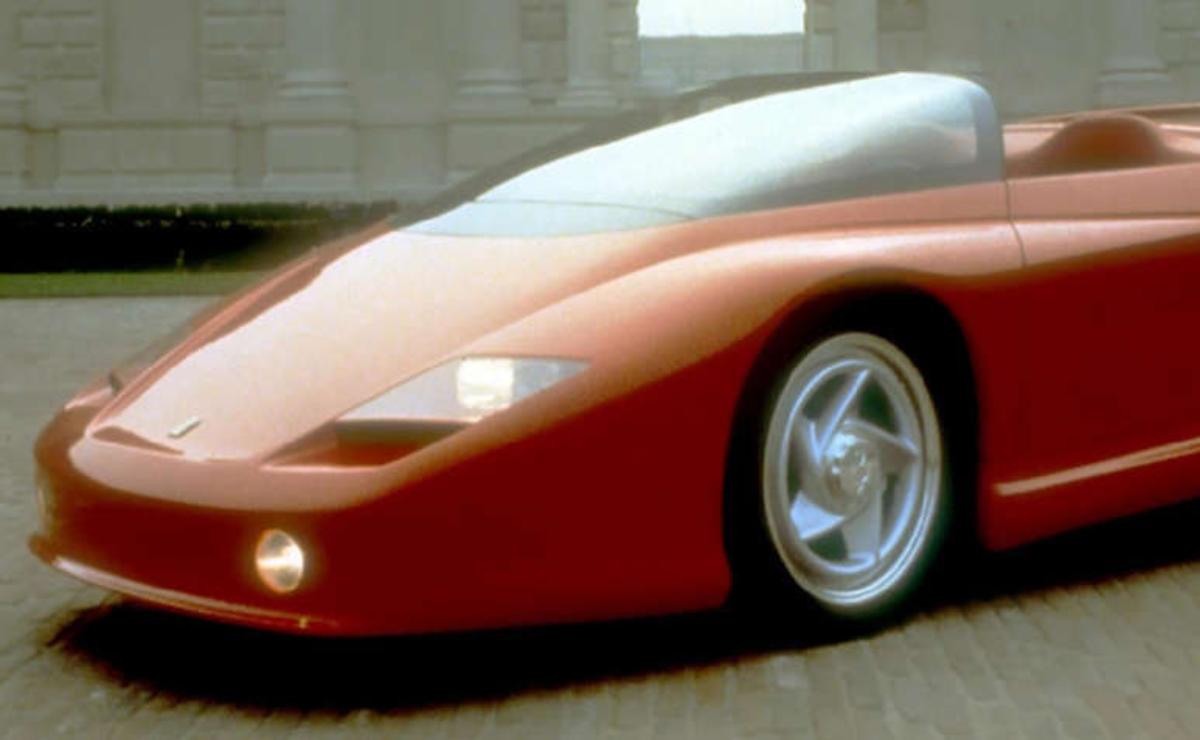 A sleek red sports car with futuristic design details.