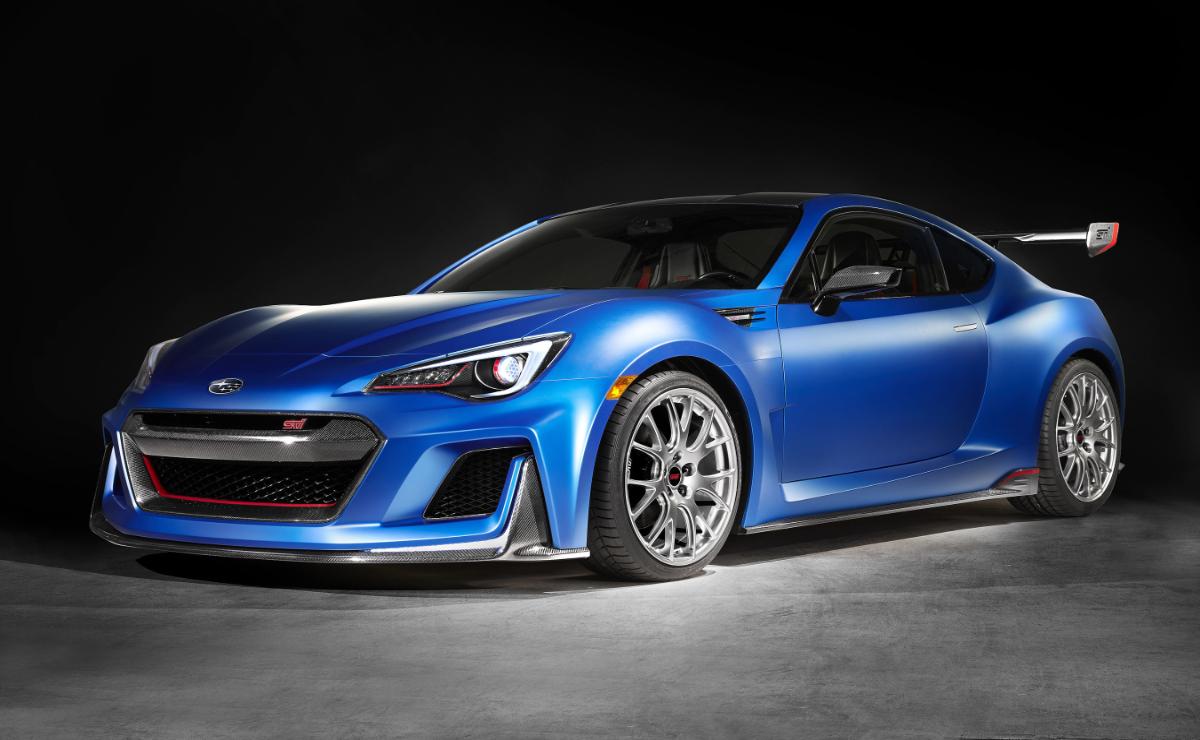 A sleek blue sports car with stylish silver rims on a dark background.