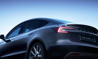 Sleek electric car with modern design and glowing taillights at dusk.