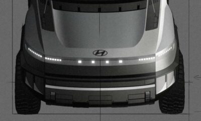 Front view of a Hyundai vehicle illuminated by LED lights at night.