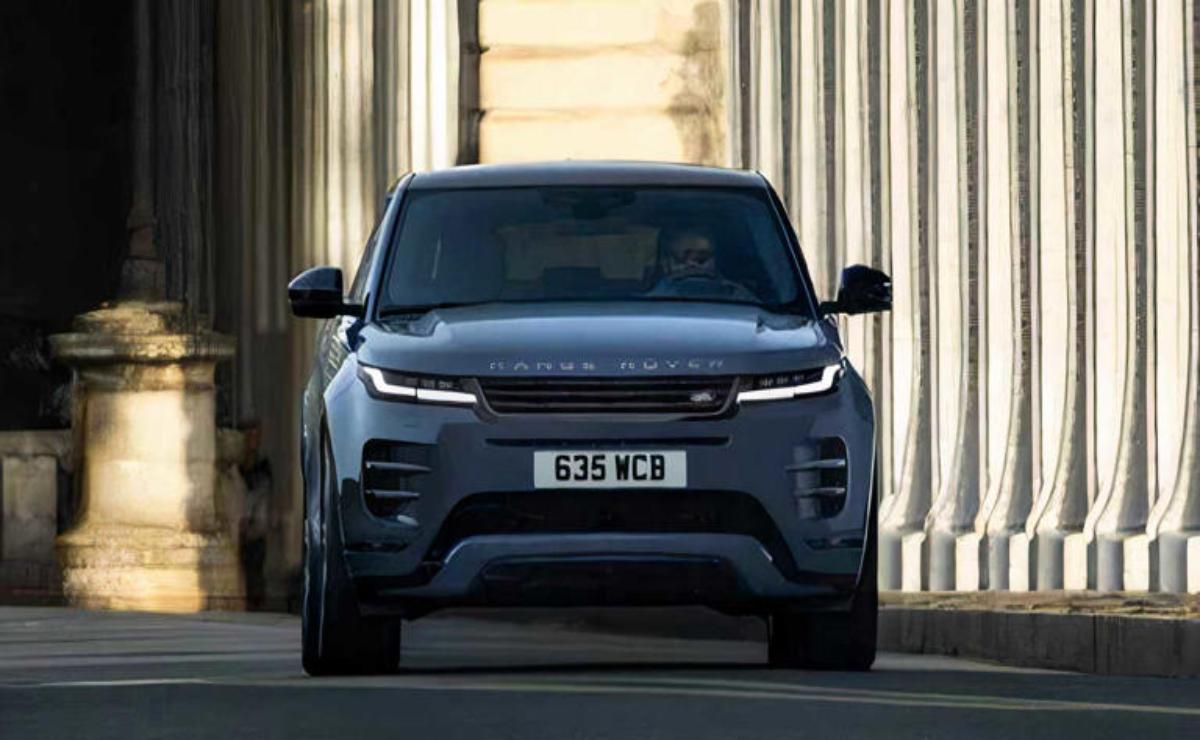 Front view of a sleek dark gray Range Rover in an urban setting.