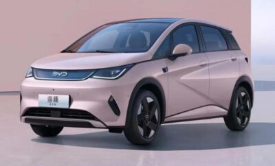 Sleek silver electric car with modern design and aerodynamic features.