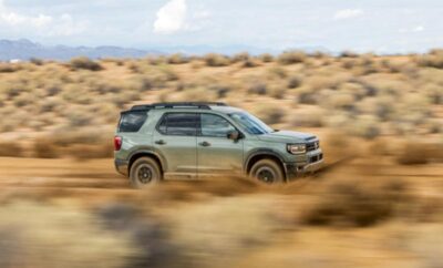 SUV driving fast through a desert landscape.