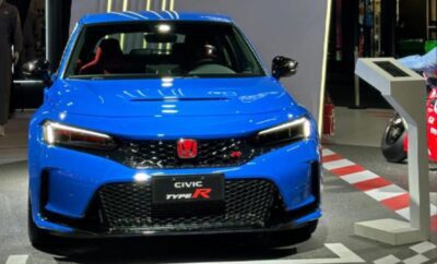 Blue Honda Civic Type R displayed indoors with sporty design.