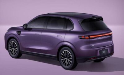 Sleek purple electric SUV with modern design and tinted windows.