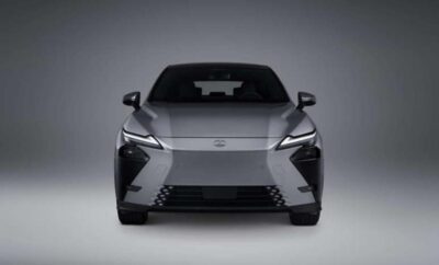 Front view of a sleek silver car with modern design and sharp headlights.