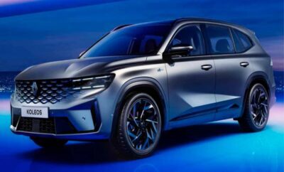 Sleek modern SUV with futuristic design illuminated in blue lighting.