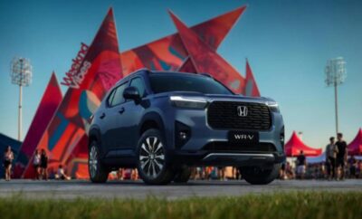 A sleek black Honda SUV parked in front of a vibrant red star sculpture.