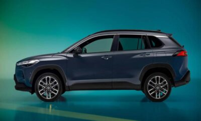 Side view of a sleek dark blue SUV with modern design and alloy wheels.