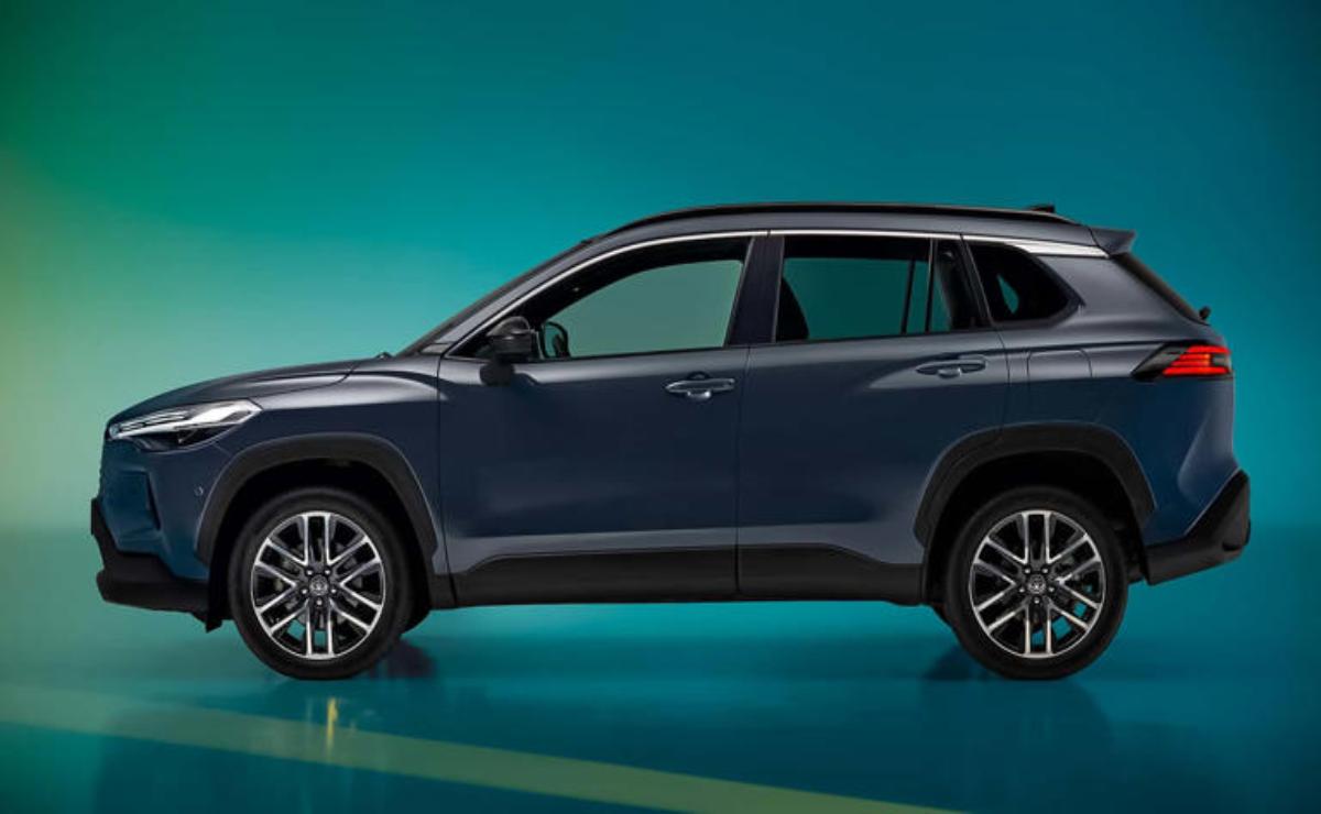 Side view of a sleek dark blue SUV with modern design and alloy wheels.