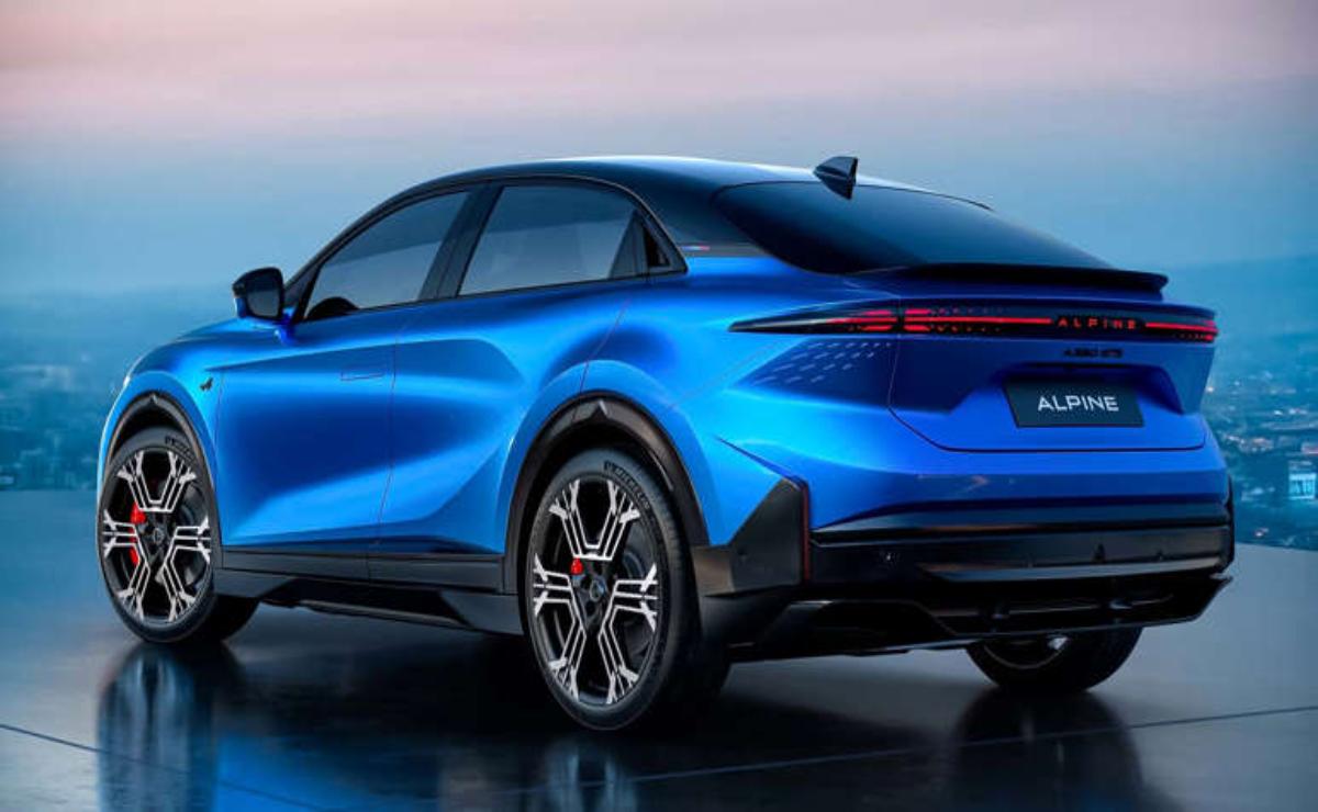 Sleek blue electric SUV parked with a scenic sunset backdrop.