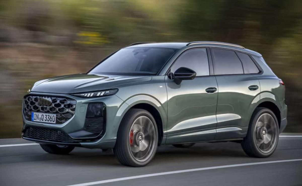 A sleek, modern SUV driving on a road with motion blur.