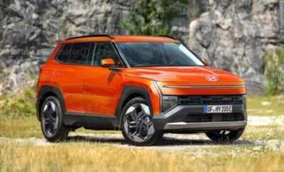 An orange modern SUV parked outdoors near rocky terrain.