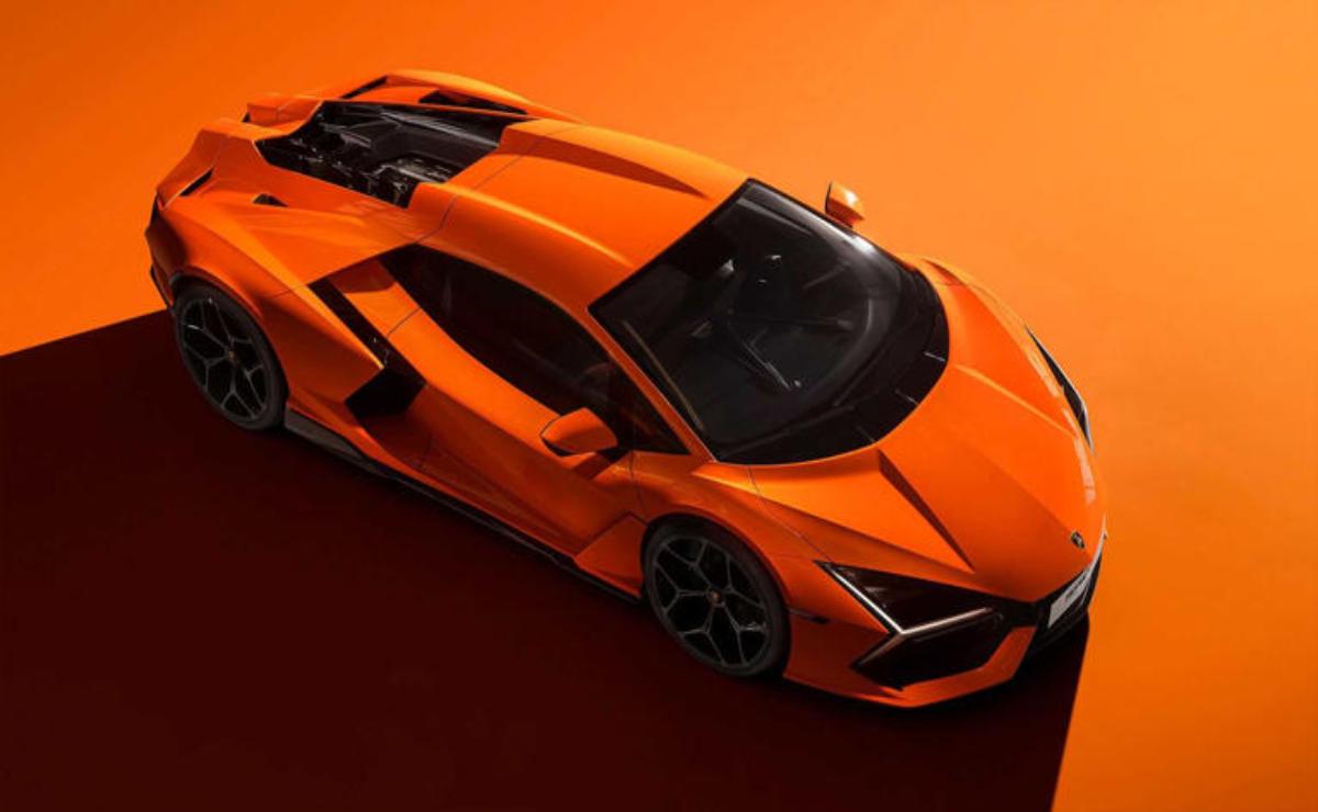 Sleek orange sports car with sharp design on an orange background.