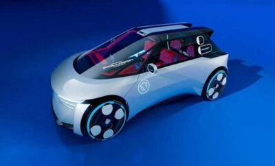 Futuristic silver concept car with a sleek design and transparent roof.