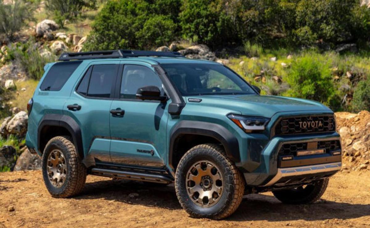 A rugged blue SUV parked outdoors in a natural setting.