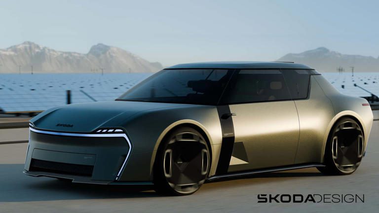 Futuristic silver electric car with sleek design and unique wheels by Škoda.