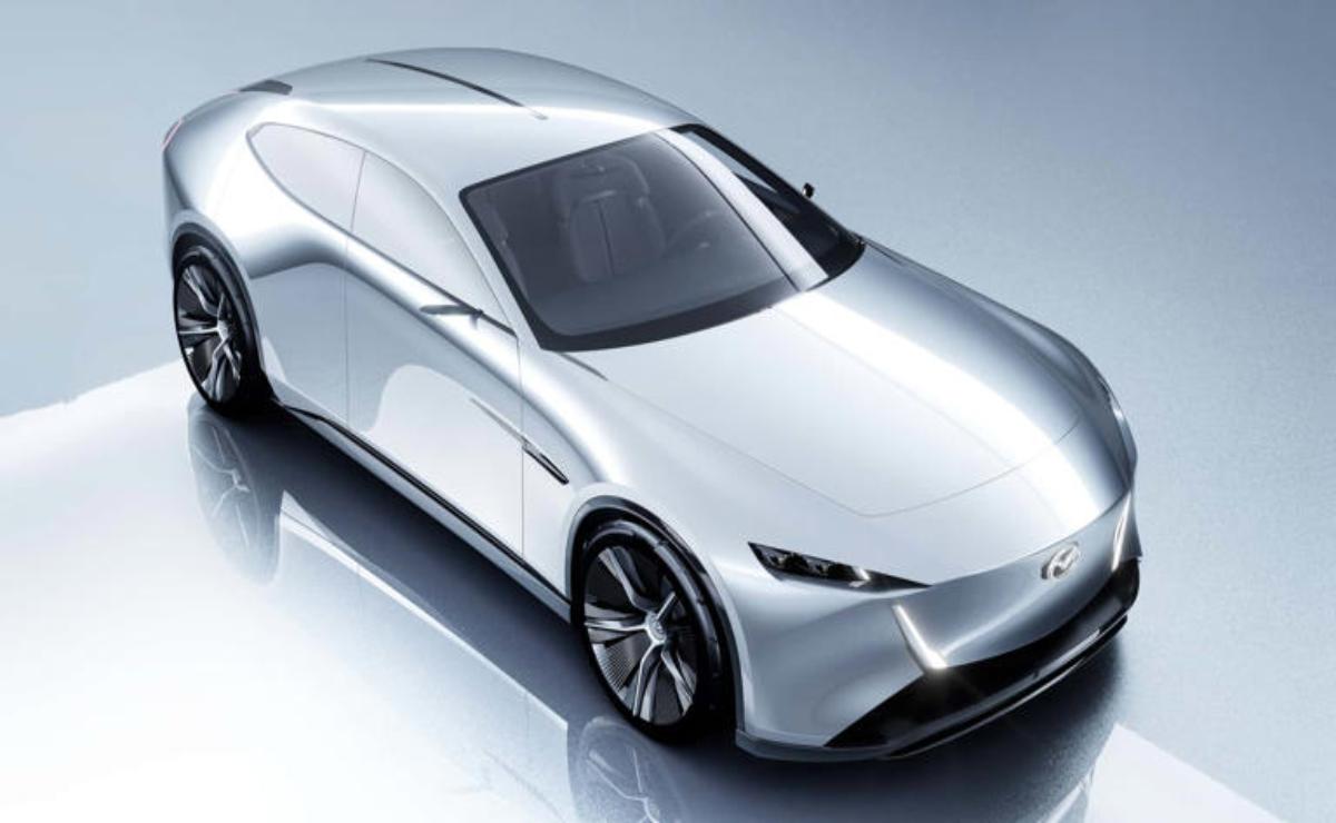 Sleek silver futuristic sports car with aerodynamic design.