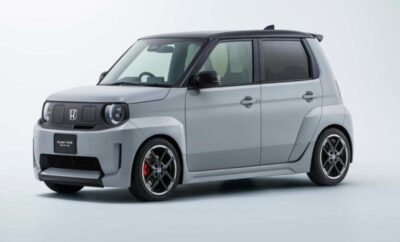 Compact silver hatchback car with black roof and sporty accents.