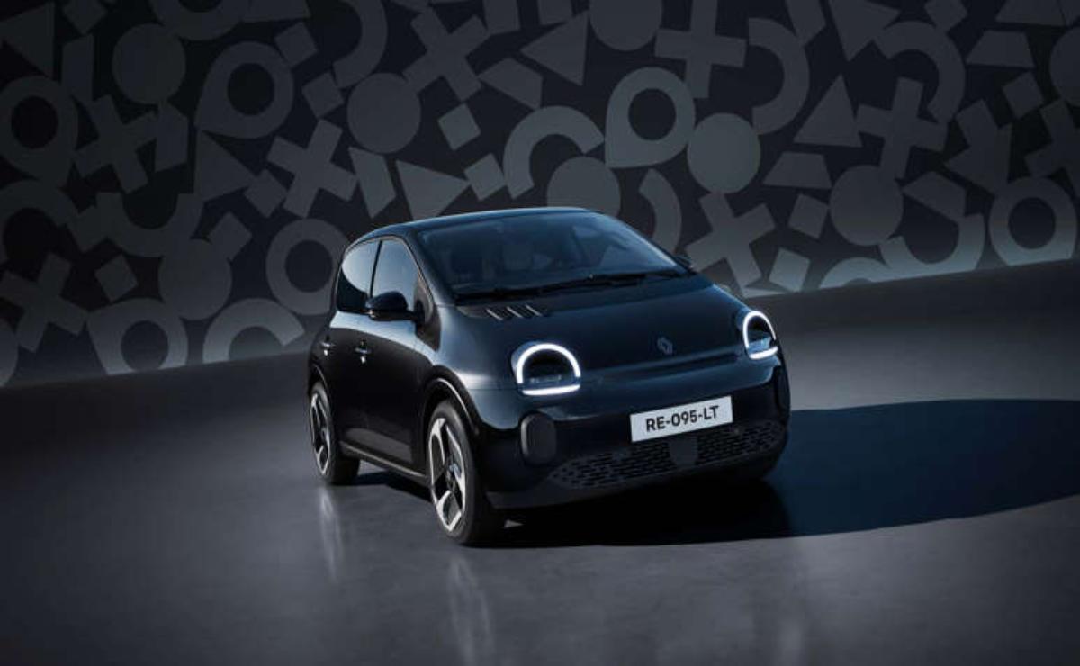 A sleek black electric car with modern LED headlights in a studio setting.