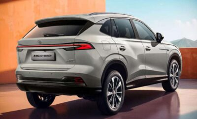 Rear view of a sleek silver SUV parked on a modern driveway.