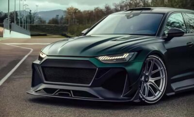 Sleek dark green sports car with sharp LED headlights and aggressive front grille.