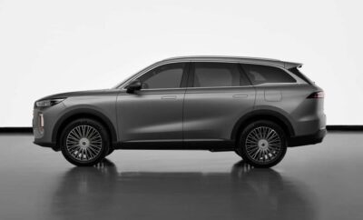 Sleek black luxury SUV with tinted windows on a reflective surface.
