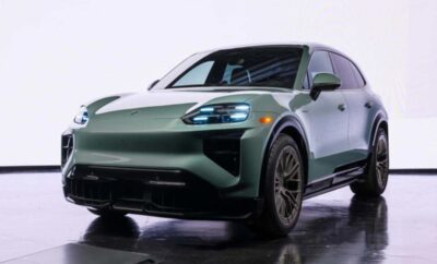 Sleek silver electric SUV with modern LED headlights on display.