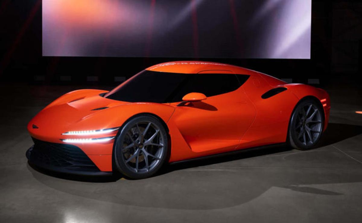 Sleek orange sports car with futuristic design and sharp aerodynamics.