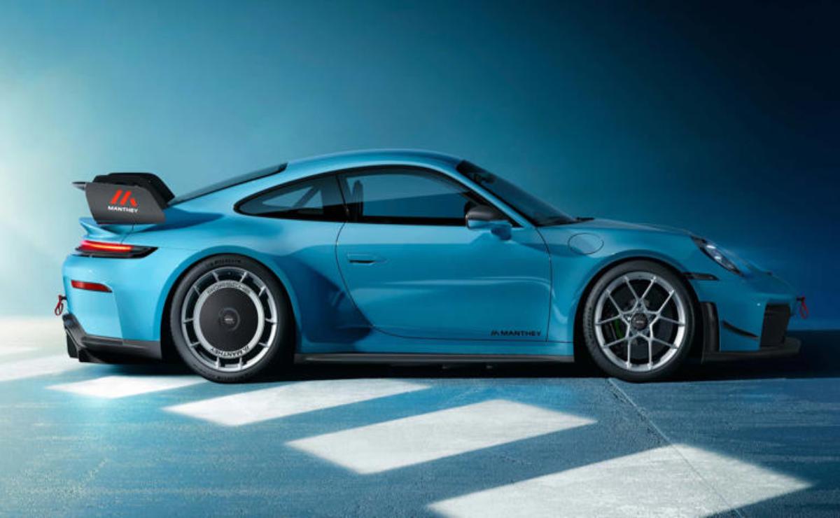 Sleek blue sports car with modern design in a studio.