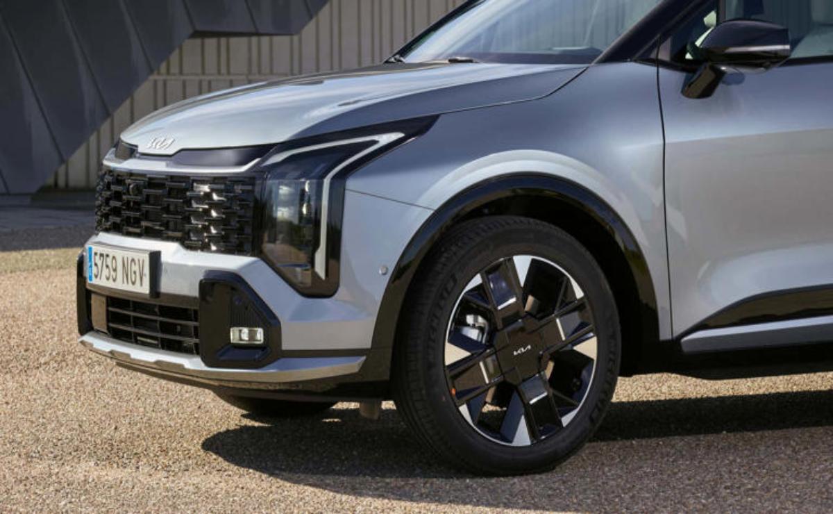 Close-up of a sleek modern car front and black wheel.