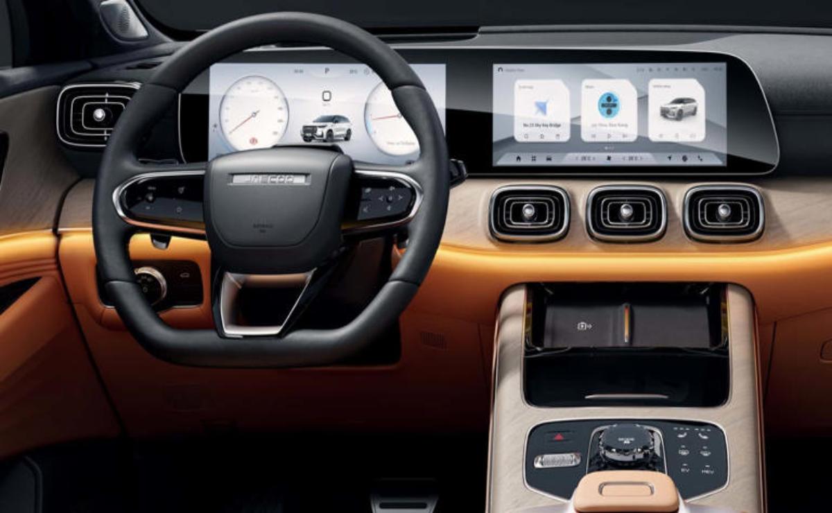 Modern car dashboard with digital displays and wooden trim.