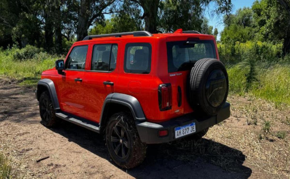 Red SUV parked outdoors on a sunny day.