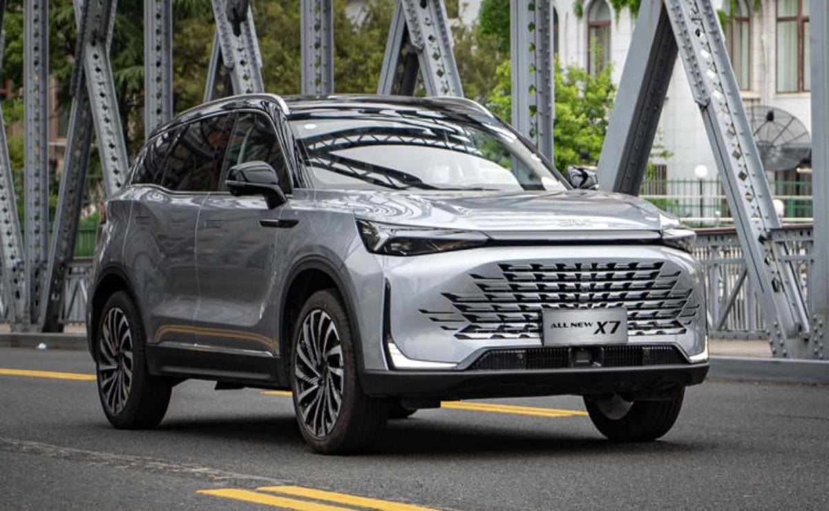 Silver SUV parked on a bridge with modern design elements.