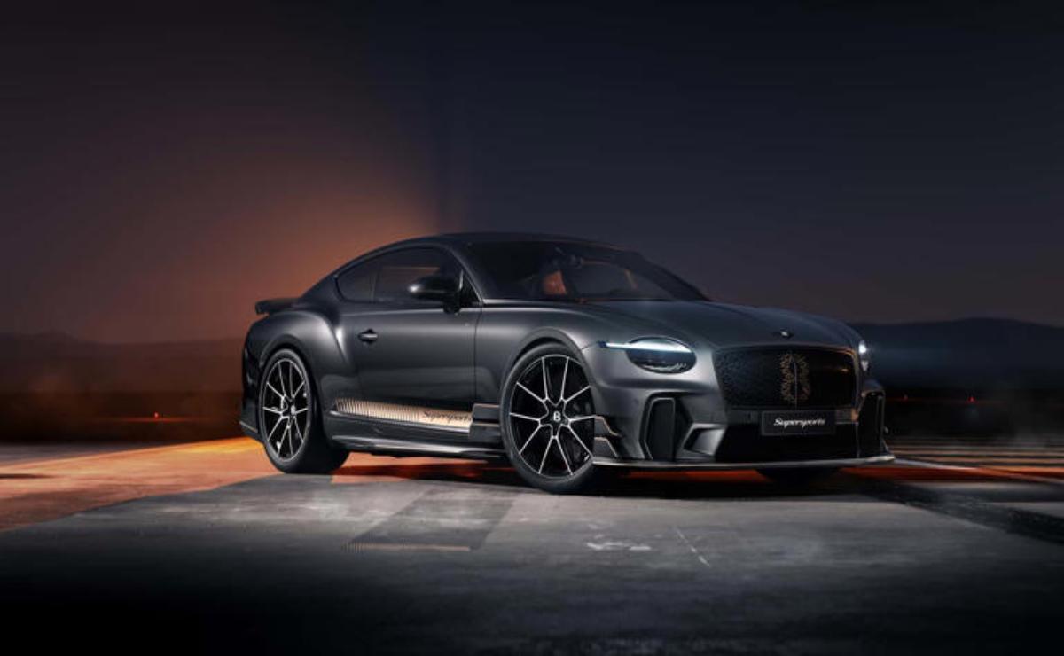 Sleek black sports car with glowing red underglow lighting in a dark setting.