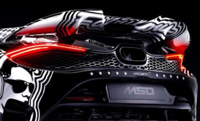 Close-up of a sleek black McLaren MSO sports car rear with distinctive taillights.