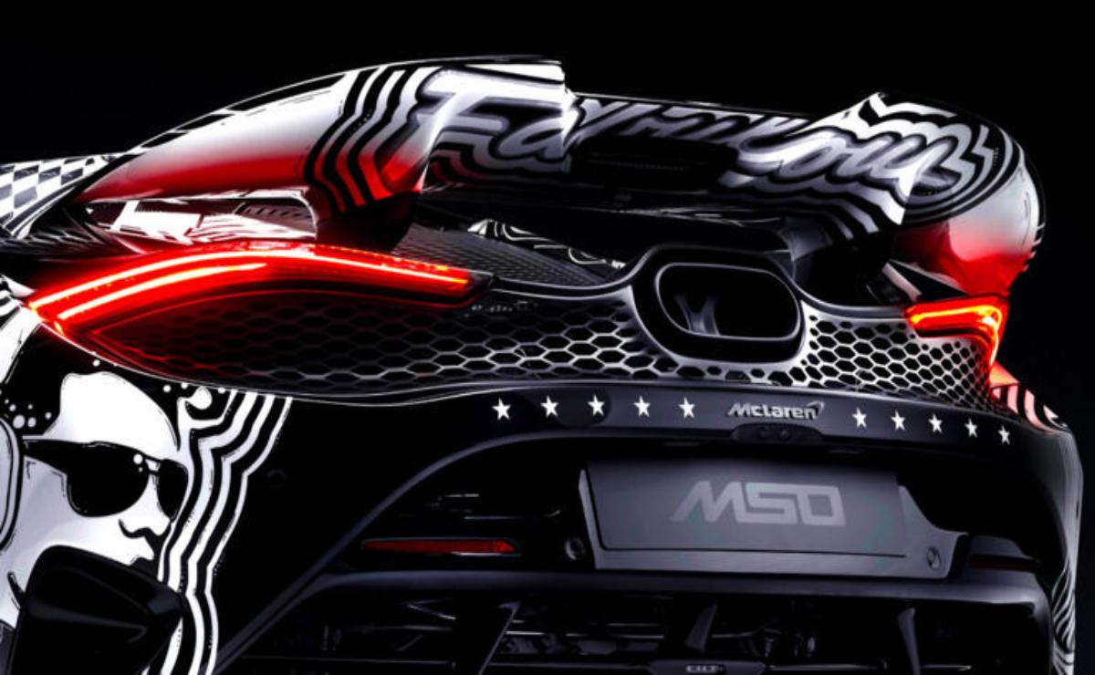 Close-up of a sleek black McLaren MSO sports car rear with distinctive taillights.