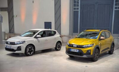 Two modern cars parked inside a showroom with white walls and lighting.