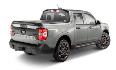Sleek gray pickup truck with modern design and black alloy wheels.